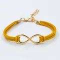 Yellow braided suede infinity bracelet with a golden metal symbol and lobster clasp - Yellow