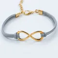 Fashion infinity symbol bracelet with golden metal charm and grey suede double ropes - Gray