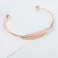 Elegante bracciale rigido aperto in oro rosa con motivo a foglie e sfere - Oro Rosa (8717)