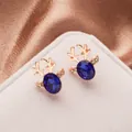 Rose gold reindeer stud earrings featuring navy blue gemstones and micro-pave crystals - Rose Gold Royal Blue