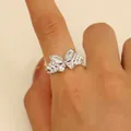Sparkling silver butterfly ring featuring multiple crystals on an open adjustable band - Pave Zirconia Butterfly Style (S428) / White K/Silver