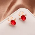 Elegant rose gold reindeer stud earrings featuring a red oval stone and micro-pave crystals - Rose Gold Red