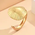 Adjustable golden stainless steel ring featuring a detailed scallop seashell design - Shell / Gold