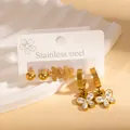 Detail of 18k gold plated butterfly earrings set with sparkling zircons on white display - Butterfly Rhinestone Earrings (BJGE1207)