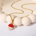 Golden stainless steel necklace featuring a vibrant red and white enamel mushroom pendant - Red Mushroom