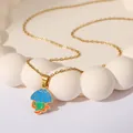Golden necklace with blue jellyfish enamel pendant featuring green and orange stripes - Blue Mushroom