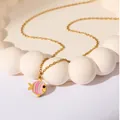 Golden stainless steel necklace featuring a tropical fish pendant with pink enamel stripes - Pink Fish