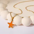 Golden stainless steel necklace featuring an orange enamel starfish pendant on a gold O-chain - Orange Starfish