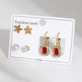 Three-pair stainless steel earring set with gold flowers, studs, and ruby red drops - Matte Five-Petal Flower And Red Rectangular Stone Dangle Theme Style (BJGE1561)
