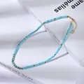 Dettaglio della collana di perle turchesi blu cielo con distanziatori dorati e gancio - Stile Blu Cielo(XL896052)