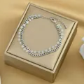Dettaglio bracciale a doppio strato in argento con perline quadrate su raso dorato - Argento