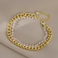 Elegante bracciale a doppio strato dorato con perline rosa satinato e chiusura a moschettone - Stile Perline Rosa in Metallo Dorato (SL89354)
