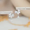 Macro detail of silver butterfly earrings with sparkling cubic zirconia teardrop pendant - Butterfly Waterdrop Style (ED66537) / Silver
