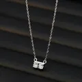 Elegant silver-toned necklace with two round-cut zircon pendants on a sleek cable chain - Silver