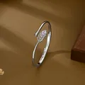 Adjustable feather bangle with micro-paved zircons and a teardrop stone on leather - Silver