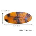 Amberkleurige hars haarklem met blauwe strass-steen en gegraveerde details - Amber