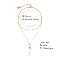 Detail view of double-layer gold necklace with pearls, heart pendant and size specs - Double Layer Pearl Ring Heart Pendant Style (NCN00858)