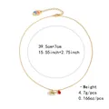 Detailed view of golden necklace with pig and red gem charms, featuring length measurements - Golden Pig and Red Gemstone Double Pendant Style (NCN00857)