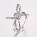 Silver bow knot ring with micro-paved white zircons in a minimalist luxury style - Ribbon Bow Pavé Style (NCR00500) / Silver