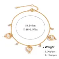 Elegant gold-tone adjustable heart bracelet with faux pearls and sparkling rhinestones - Gold Triple Heart Faux Pearl Style (NCB00474)