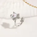 Exquisite silver-tone open ring featuring a heart-shaped zircon and small floral accents - Silver