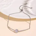 Adjustable silver tone bolo bracelet with sparkling CZ stones and round center piece - Silver Full Pave Round Disc Style (NCB00305-2)