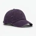 Close-up of deep purple washed cotton baseball cap with vintage distressed texture - Blank Style / Purple