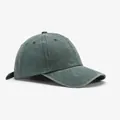 Detail view of washed dark green cotton fabric and reinforced stitching on baseball cap - Blank Style / Green