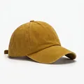 Detail of mustard yellow washed cotton baseball cap with adjustable strap and stitched eyelets - Blank Style / Ginger Yellow