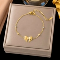 Elegant gold titanium steel bracelet featuring a delicate bow pendant and zircon stones - Bow Knot Bracelet (SLE2058)