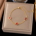 Elegant gold titanium steel bracelet featuring three round red gemstones with lobster clasp - 【sle2153】three Red Diamonds Bracelet Gold
