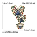 Broche papillon dorée verticale avec strass multicolores et pierres précieuses bleues - Coloré