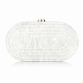 Detail of white marble acrylic evening clutch with tiered oval design and gold clasp - White