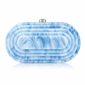 Macro detail of acrylic evening clutch with blue marble texture and gold metal lock - Sapphire Blue