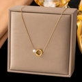 Elegant gold necklace with a hollow clover circle pendant and a white pearl detail - 【h373】round Four-leaf Clover Necklace Gold