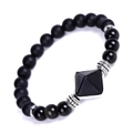 Detail of matte black onyx beads and pyramid pendant on a minimalist beaded bracelet - Obsidian Pyramid Matte Stone Bracelet
