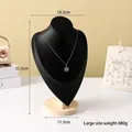Large matte black mannequin bust display for necklaces featuring a silver snowflake pendant - Black Leather Large