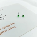 Elegant 925 silver stud earrings with four-prong round green zircon gemstones - Forest Green