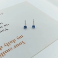 Minimalist S925 silver stud earrings featuring vibrant blue round zircon in a four-claw setting - Light Blue