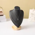 Silver heart pendant necklace with blue stones on a black wood display stand - Dark Gray Velvet Medium