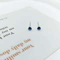 Minimalist S925 silver stud earrings featuring round deep blue zircon in four-claw setting - Marbled Glazed