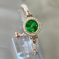 Detailed macro view of the rose gold quartz bracelet watch with a vibrant green dial - Green