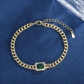 Elegant gold chain bracelet with rectangular emerald gemstone and sparkling halo accents - Rectangle Gemstone Style / Emerald Green