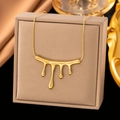 Lava droplet necklace in gold plating with sleek chain on jewelry display - XLH1078 Lava Teardrop / Gold