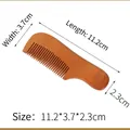 Eco-friendly bamboo hotel comb variant with 11.2cm length and clear natural wood grain - Handle Comb Pear Wood 112