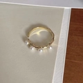 Detailed view of adjustable golden ring featuring four white pearls and wave texture - Four Pearls Wavy Open Ring (JZ0602)