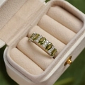 Silver flower ring with olive green oval gemstones and small white zircons in a box - Olive Green Oval Row Rhinestone Ring