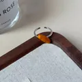 Adjustable silver ring featuring an oval amber resin stone in a minimalist retro style - Amber Long Oval Open Ring