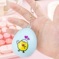 Mini light blue egg-shaped virtual pet keychain with cute yellow chick pattern - Egg Shell Flip/Blue