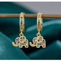 Vintage gold elephant earrings featuring colorful zircon stones on dark green velvet - Gold